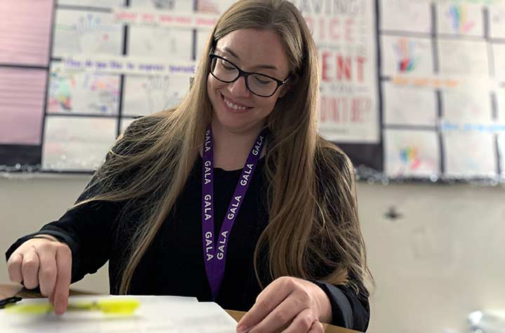 Alumnae Adrianne Warlick working in her classroom.