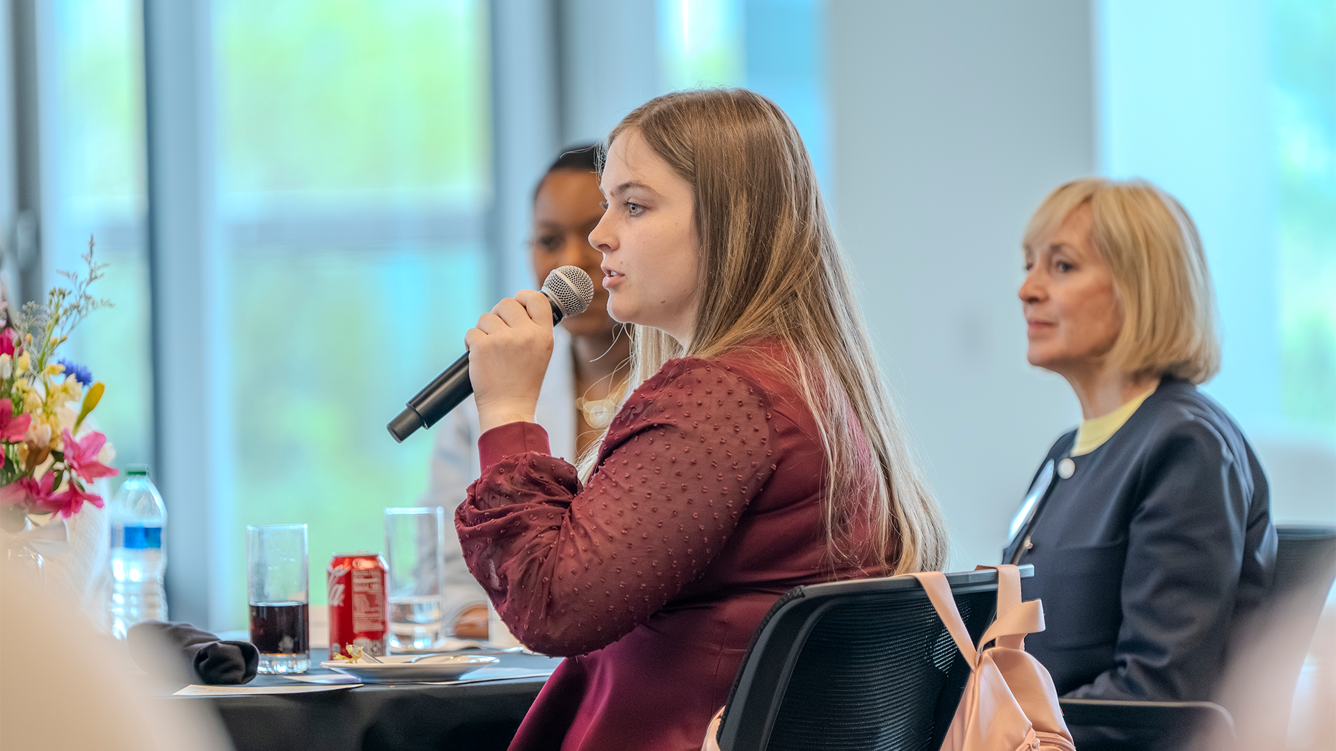CEO Scholar Photo Student speaking into microphone at an event