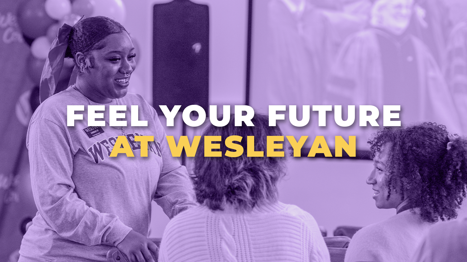 Feel your future at wesleyan button 1080 Student speaking and smiling with two seated attendees in a lounge setting, overlaid with a purple tint and bold text reading “Feel Your Future at Wesleyan.”