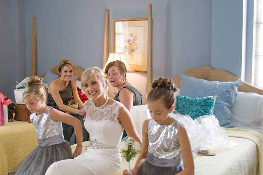 Bridal party hanging out in a bedroom on campus that you can rent out