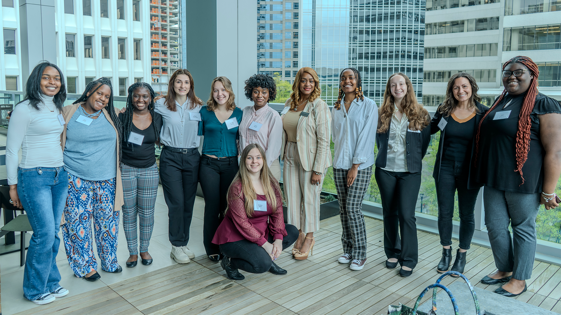 Group photo of CEO students at a professional event